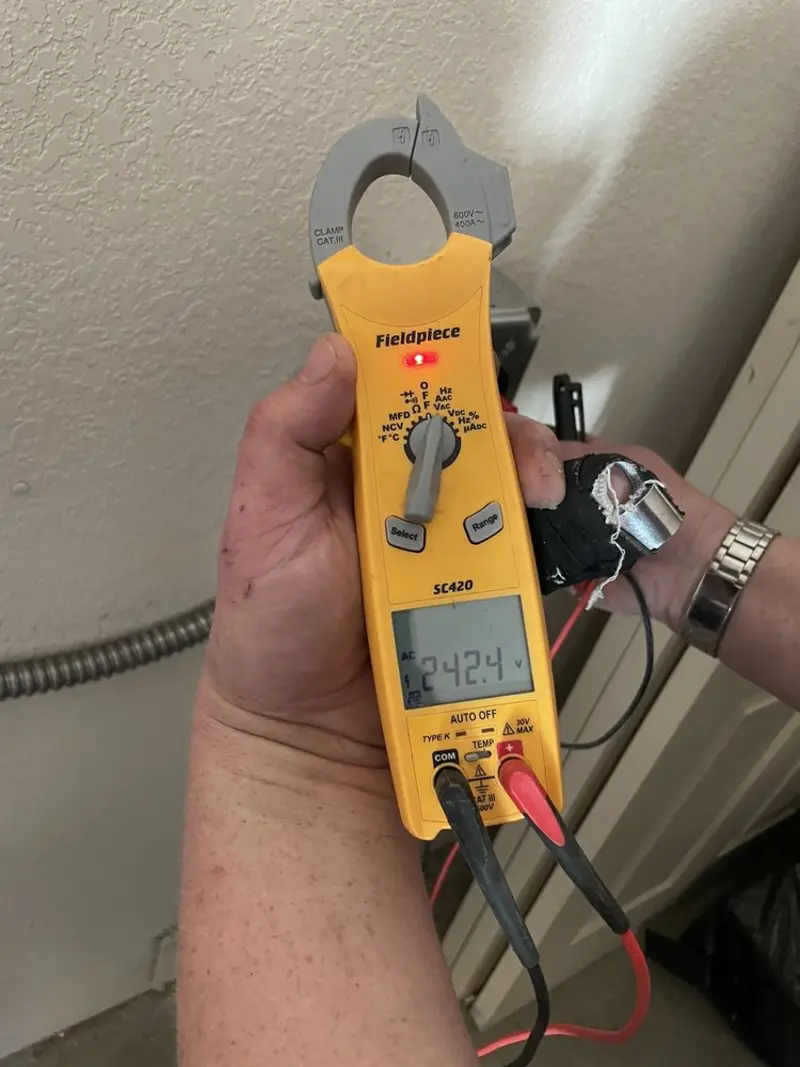 Voltage testing with clamp meter during Electrical Installation Services in Barrington